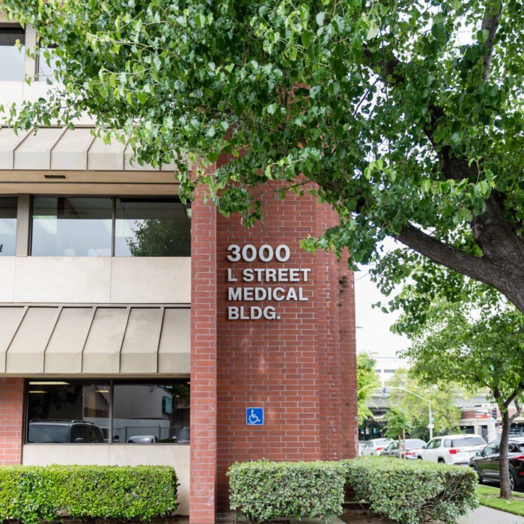 location and hours page; Exterior of The Smile Doctor dental office in Sacramento showing practice entrance